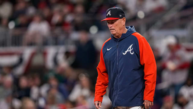Apr 9, 2023; Cumberland, Georgia, USA; Atlanta Braves manager Brian Snitker (43) walks to the pitcher mound to change pitchers against the San Diego Padres during the fifth inning at Truist Park.